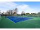 Well-maintained community tennis court with pristine green and blue surfaces at 1808 Southard St, Erie, CO 80516