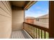 View from the balcony overlooking neighboring homes and a blue sky, creating a serene outdoor living space at 1518 Sepia Ave, Longmont, CO 80501