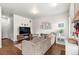 Cozy living room featuring hardwood floors, a comfortable couch, and modern decor at 1518 Sepia Ave, Longmont, CO 80501