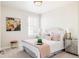 Cozy bedroom featuring a upholstered headboard, soft colors, and ample natural light at 14537 Honolulu Cir, Parker, CO 80134