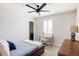 Comfortable bedroom with study desk, plantation shutters, and neutral decor at 14537 Honolulu Cir, Parker, CO 80134