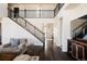 Bright living room with a staircase, hardwood floors, and an open layout, creating a welcoming atmosphere at 14537 Honolulu Cir, Parker, CO 80134