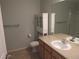 Bathroom featuring a toilet, vanity, sink, and cabinet at 559 Alton Way # E, Denver, CO 80230