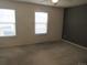 Bedroom featuring large windows, and a neutral carpet at 559 Alton Way # E, Denver, CO 80230