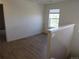 Bright bonus room with hardwood floors and natural light streaming through the window at 559 Alton Way # E, Denver, CO 80230