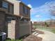 The outdoor patio area is partially enclosed and leads toward the sidewalk and green spaces at 559 Alton Way # E, Denver, CO 80230