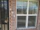 Close up of the front door and address details of the townhouse with decorative address tiles and security door at 559 Alton Way # E, Denver, CO 80230