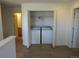 A laundry closet with washer and dryer hookups with doors at 559 Alton Way # E, Denver, CO 80230