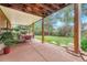 Inviting covered patio with outdoor seating, perfect for entertaining and relaxing in a serene backyard setting at 5964 S Florence Ct, Englewood, CO 80111