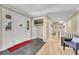 Bright foyer featuring hardwood floors, closet, and an open floor plan at 5964 S Florence Ct, Englewood, CO 80111