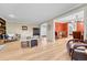 Bright living room with hardwood floors, decorative fireplace, and an open layout at 5964 S Florence Ct, Englewood, CO 80111