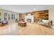 Cozy living room with hardwood floors, a fireplace, and ample natural light at 5964 S Florence Ct, Englewood, CO 80111