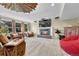 Spacious living room with fireplace, TV, and comfortable seating in finished basement at 5964 S Florence Ct, Englewood, CO 80111