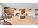 Spacious living room featuring hardwood floors, fireplace, and comfortable seating at 5964 S Florence Ct, Englewood, CO 80111