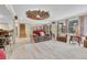 Spacious living room with a decorative ceiling, comfortable seating, and stairs in a home at 5964 S Florence Ct, Englewood, CO 80111