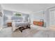 Light-filled main bedroom with carpeted floors and base trim, offering a peaceful retreat at 5964 S Florence Ct, Englewood, CO 80111