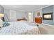 Spacious main bedroom with carpet floors, fireplace, and neutral colors, creating a relaxing retreat at 5964 S Florence Ct, Englewood, CO 80111