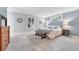 Light-filled main bedroom with carpeted floors, base trim, and lots of natural light at 5964 S Florence Ct, Englewood, CO 80111