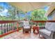 Relaxing covered patio with comfortable seating, perfect for enjoying the outdoors at 5964 S Florence Ct, Englewood, CO 80111