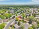 Aerial view of neighborhood with mature trees and well-maintained homes at 2311 Emery Pl, Longmont, CO 80501