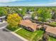 Beautiful aerial view of a residential home surrounded by lush greenery at 2311 Emery Pl, Longmont, CO 80501