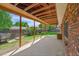 Relaxing back porch with spacious area, view to yard, and wood ceiling at 2311 Emery Pl, Longmont, CO 80501