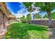 Large, sunny backyard with fence and brick house, a peaceful place for outdoor enjoyment at 2311 Emery Pl, Longmont, CO 80501