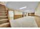 Large basement area with carpet and wood paneling at 2311 Emery Pl, Longmont, CO 80501