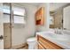 Updated bathroom featuring modern fixtures, wood cabinets and shower at 2311 Emery Pl, Longmont, CO 80501
