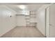 Clean bedroom with carpet, shelving and window is simple and functional for residents or guests at 2311 Emery Pl, Longmont, CO 80501