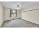 Spacious bedroom with carpet, a ceiling fan and a window bringing in natural light at 2311 Emery Pl, Longmont, CO 80501