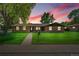 Charming brick home with a well-manicured lawn and inviting curb appeal, perfect for a Gathering at 2311 Emery Pl, Longmont, CO 80501