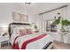 Cozy bedroom with white walls, ample natural light, and neutral decor creates a relaxing space at 3929 Shoshone St, Denver, CO 80211