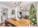 Inviting dining room with a large table, modern chandelier, and festive Christmas decorations at 3929 Shoshone St, Denver, CO 80211