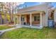 Inviting front porch with classic columns, a wooden swing, and comfortable seating at 3929 Shoshone St, Denver, CO 80211