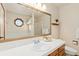 Bathroom with large mirror and updated vanity at 1749 Foster Dr, Longmont, CO 80501