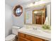 Clean bathroom with updated vanity and octagon window at 1749 Foster Dr, Longmont, CO 80501