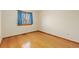 Bright bedroom with hardwood floors and a window at 1749 Foster Dr, Longmont, CO 80501