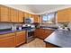 Modern kitchen with stainless steel appliances and dark countertops at 1749 Foster Dr, Longmont, CO 80501