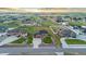 Bird's-eye view of the landscaped property, showcasing large lawn, circular driveway, and beautiful neighborhood at 29303 E 165Th Ave, Brighton, CO 80603