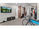 Finished basement featuring a TV, open doors, and a staircase leading to another level in this stylish house at 29303 E 165Th Ave, Brighton, CO 80603