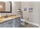 Bathroom vanity features granite countertop, rectangular sink and blue cabinets at 29303 E 165Th Ave, Brighton, CO 80603
