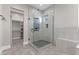 Bathroom features a glass enclosed shower with tile surround and a built-in bench at 29303 E 165Th Ave, Brighton, CO 80603
