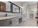 Bathroom vanity features dual sinks, granite countertop, and under-mount cabinets at 29303 E 165Th Ave, Brighton, CO 80603