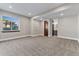 Bedroom with plush carpet, large window, neutral walls, and access to bathroom at 29303 E 165Th Ave, Brighton, CO 80603