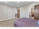 Bedroom features carpet flooring, a queen bed, and hardwood door frames at 29303 E 165Th Ave, Brighton, CO 80603