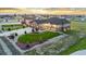 A well-manicured lawn and three-car garage accent this stunning home's exterior at 29303 E 165Th Ave, Brighton, CO 80603