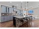 Modern kitchen with large island, seating, and stainless steel appliances at 29303 E 165Th Ave, Brighton, CO 80603