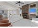 Open floor plan with a living room, fireplace, hardwood floors, and a view to the dining area at 29303 E 165Th Ave, Brighton, CO 80603