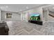 Open living room featuring wood-look floors, recessed lighting, and media center with large television at 29303 E 165Th Ave, Brighton, CO 80603